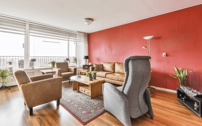 An image of a colored accent wall with an artwork