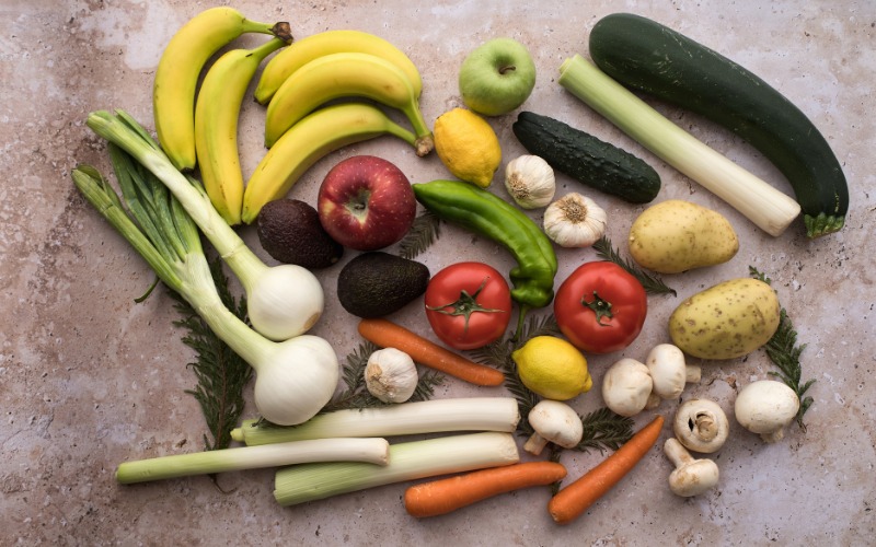 An image of a kitchen with produce on a countertop