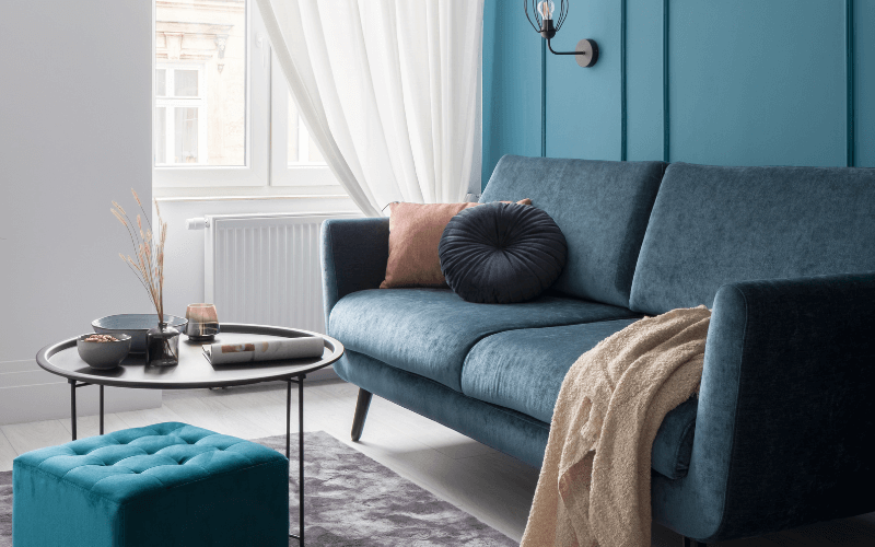 An image of a teal-colored sofa