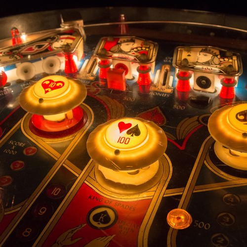 Small image of a pinball machine in a bedroom