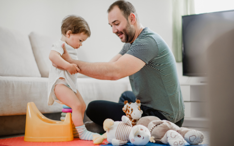 A patient parent comforting a frustrated toddler
