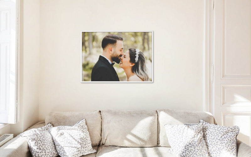 Framed wedding photos on wall