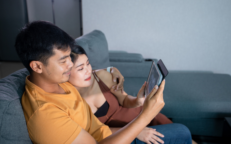Smiling couple looking at ultrasound