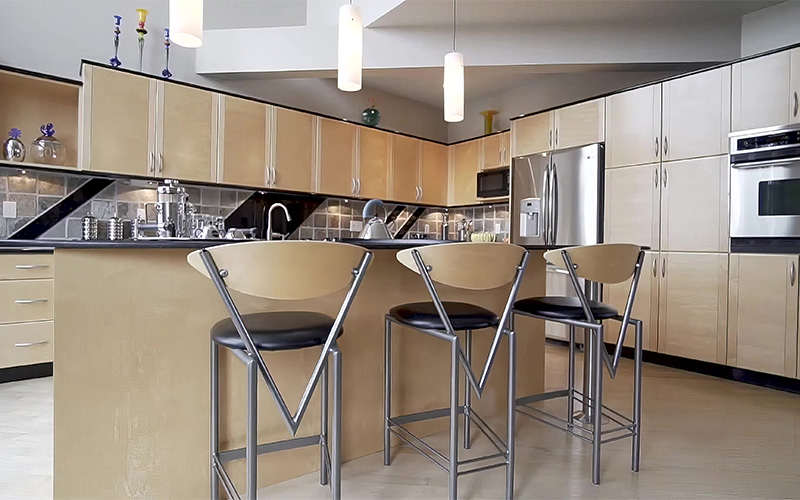 A stock photo of a well-lit kitchen area.