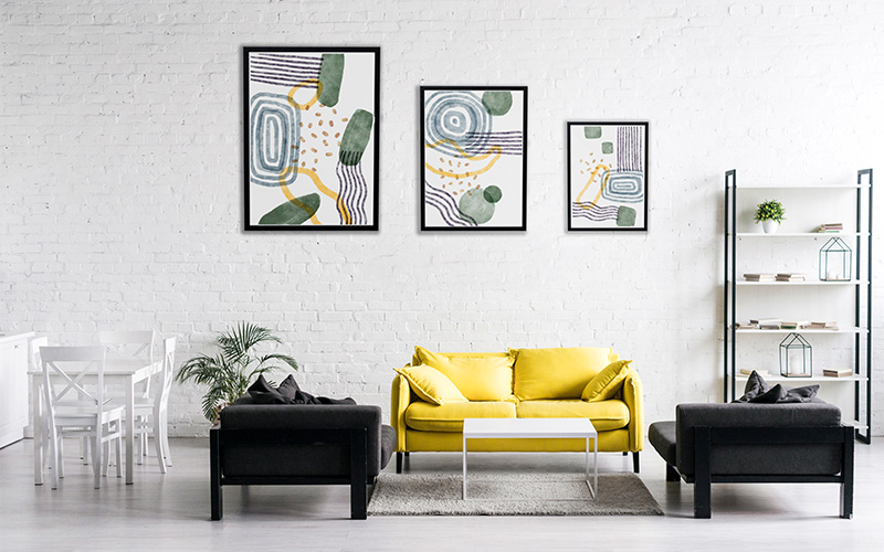 An image of a wall with artworks