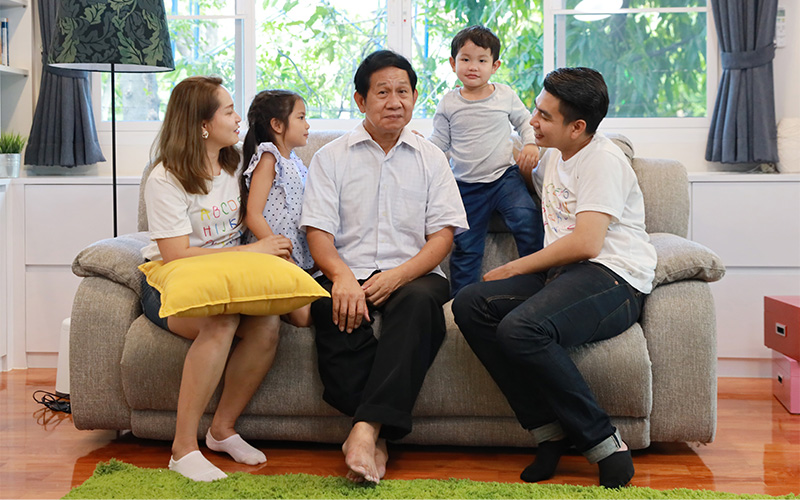 Image of a large family bonding in the living room