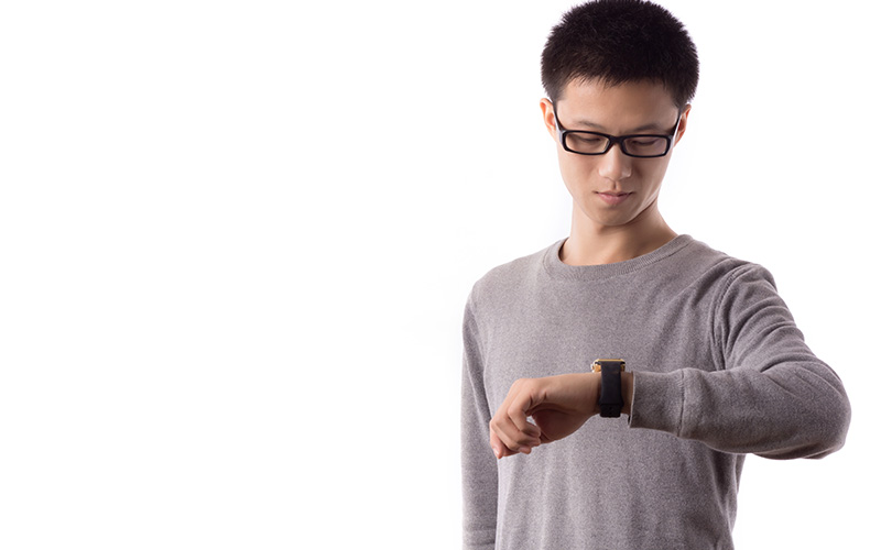 Image of a person looking at their watch