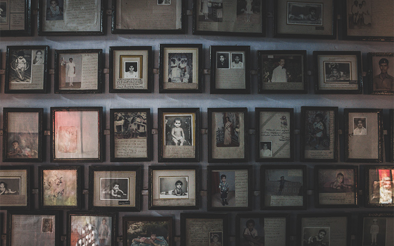 Image of a photo wall filled with group photos