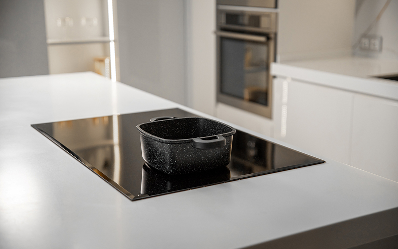 Image of a kitchen island with a stove top