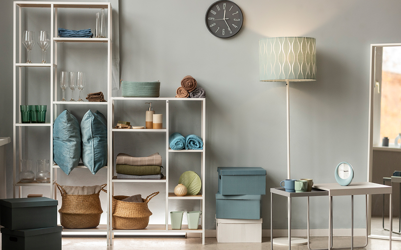 A room with an organised interior with items packed in storages.