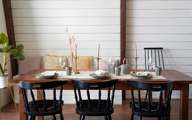 An image of a dining area with a solid wood dining table.