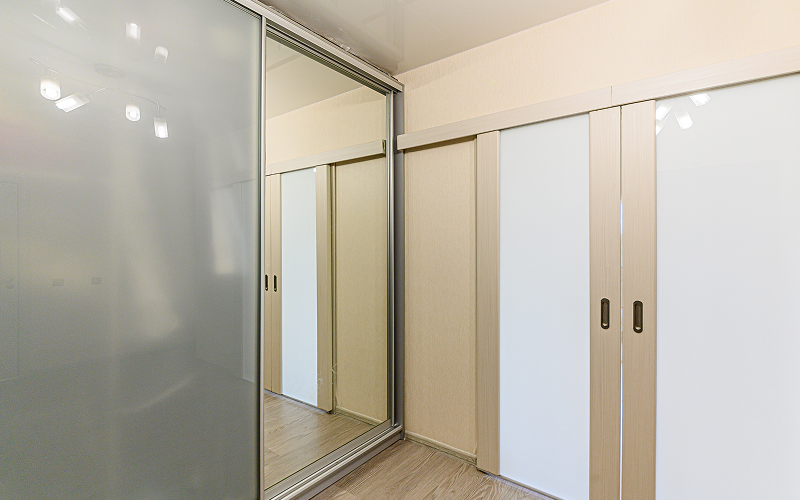 An image of a wardrobe with sliding doors.