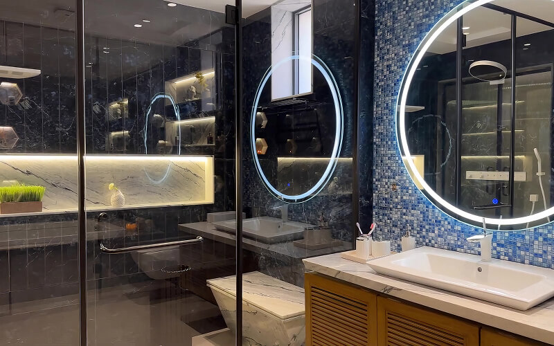Modern HDB common toilet design with LED mirror and accent tiles.