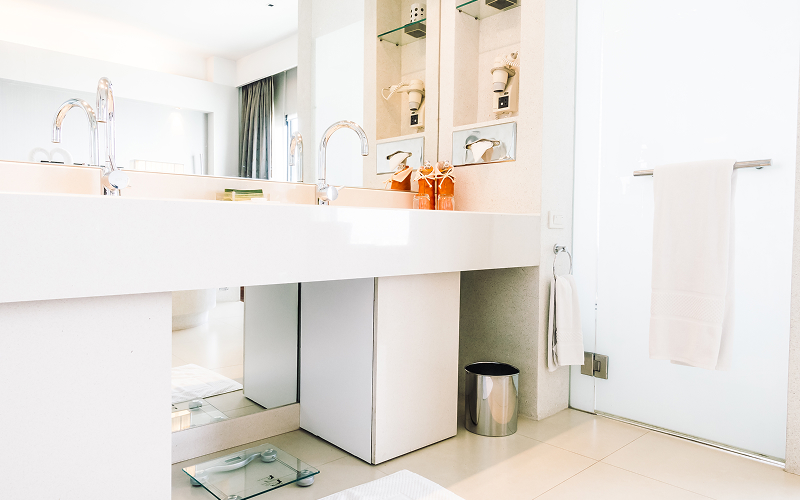 A sleek bathroom storage solution with hidden shelving