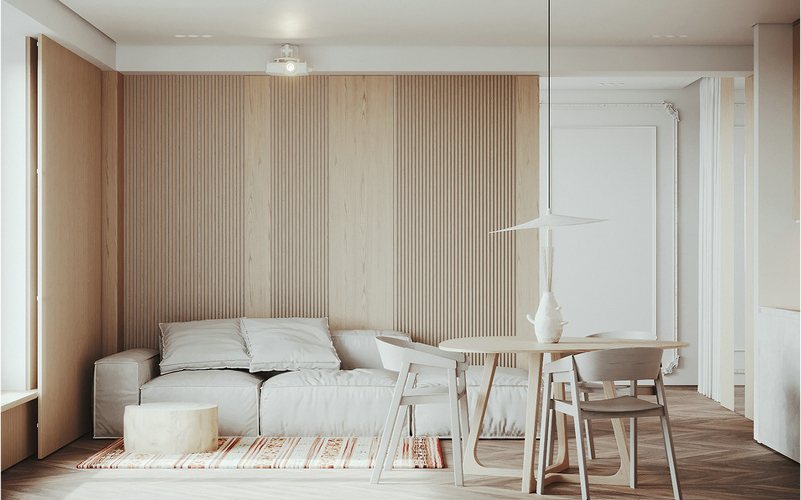 A bright compact living room with minimalist furniture and neutral tones