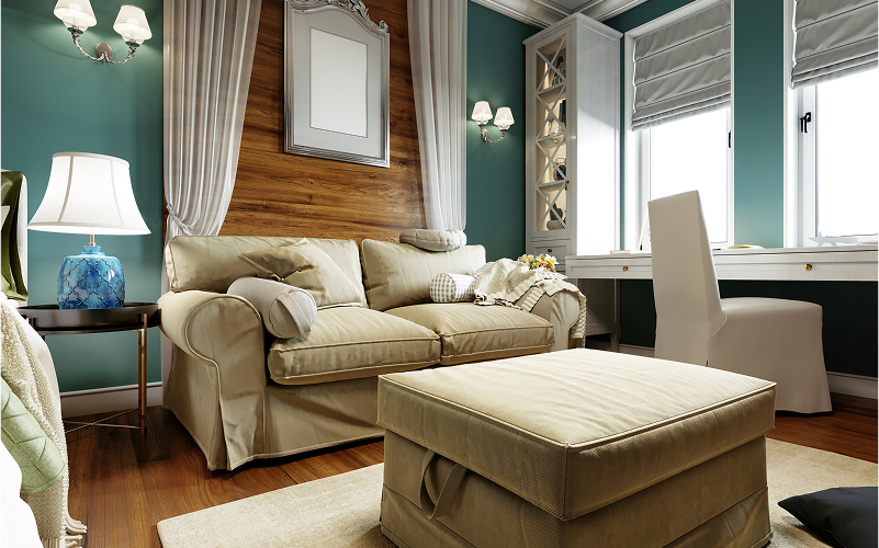 A compact living room with a sofa bed and storage ottoman.