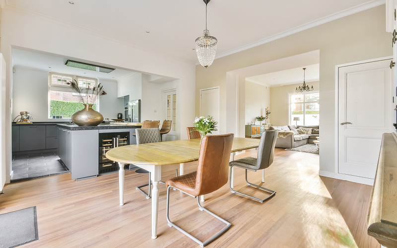 A stock photo of a bright open-plan living–dining rooms.