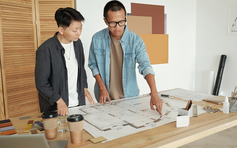 A designer discussing floor plans
