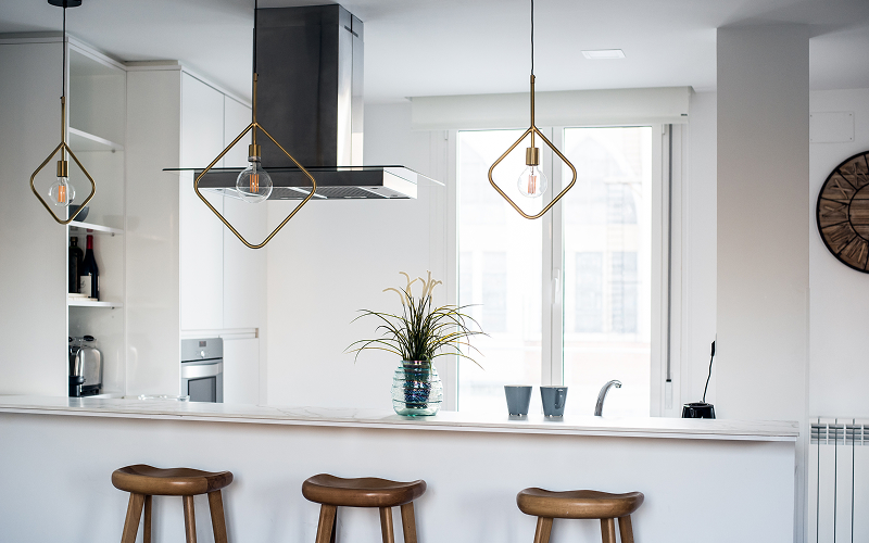 A kitchen with pendant lighting.