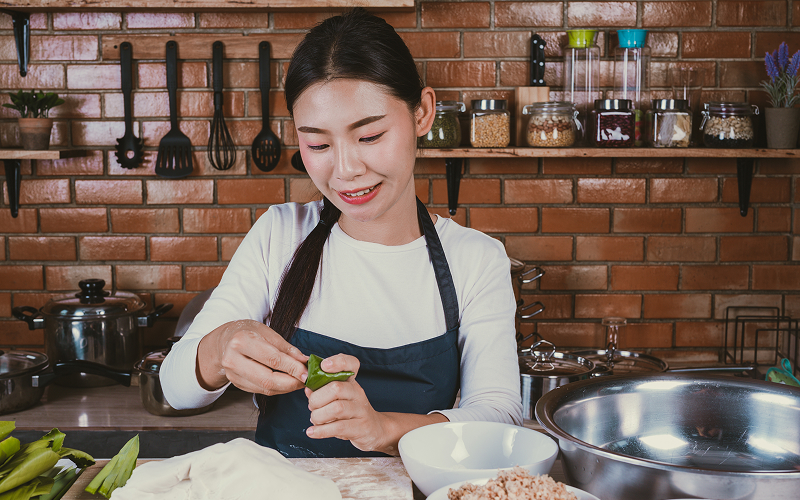 A person cooking in a minimalist kitchen