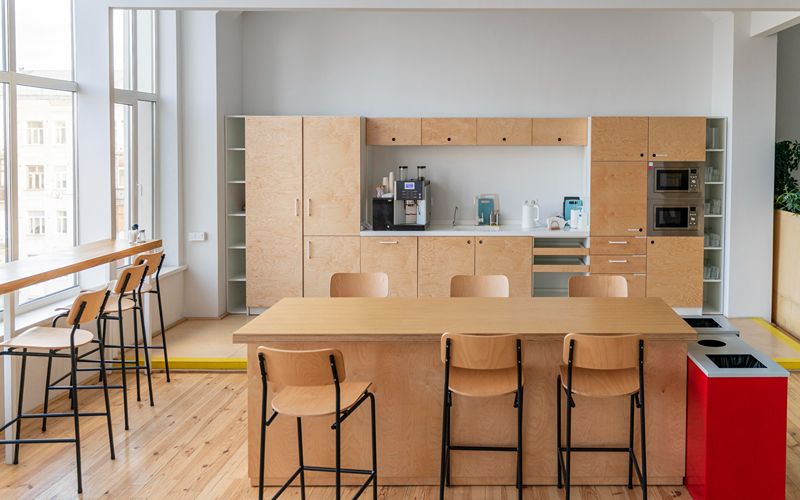 a minimalist and simple-coloured kitchen and dining layout