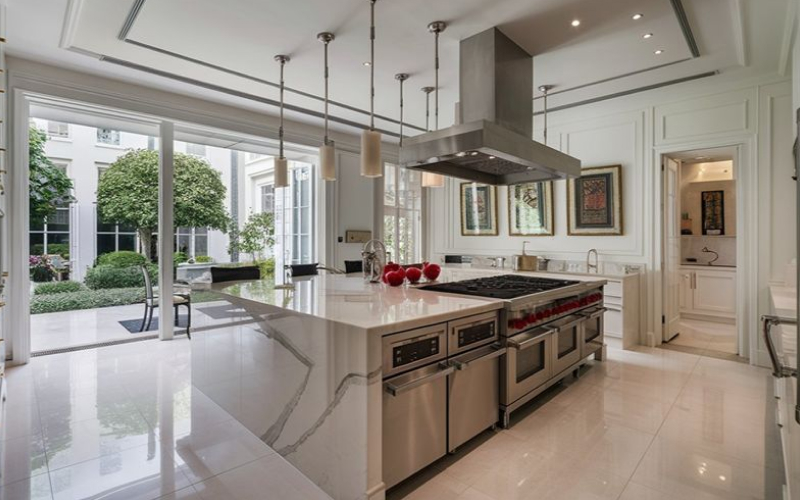 a well-lit, spacious, and modernly sophisticated kitchen
