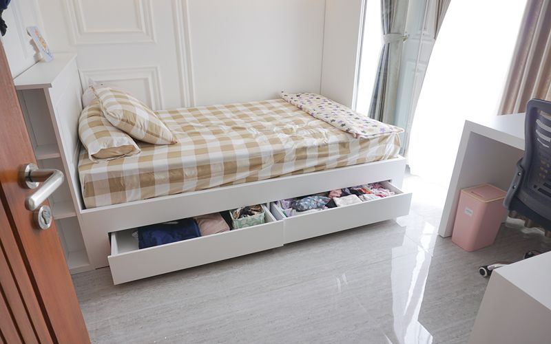 Image of a bed with drawers