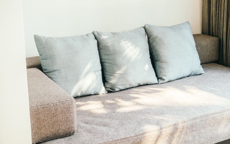 Image of plush fabric pillow on a sofa