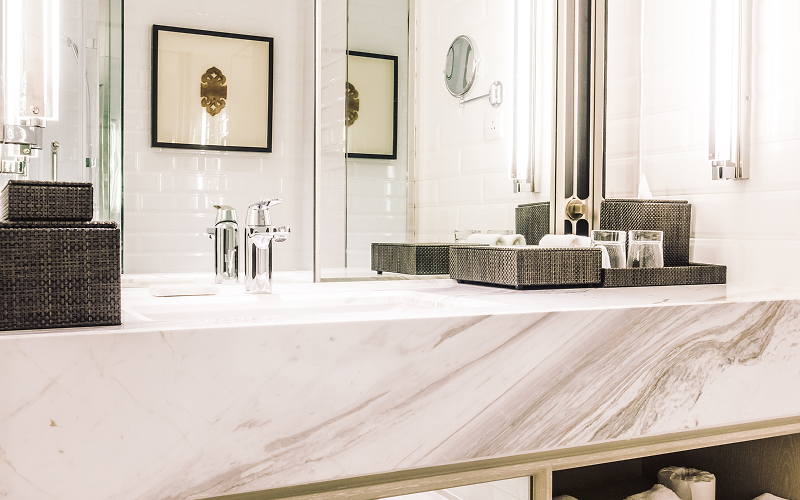 a bathroom with marble countertop