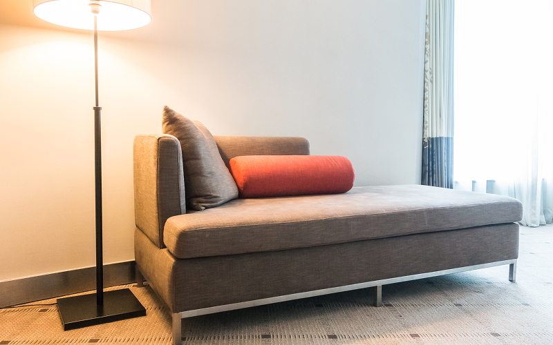 a small image of a convertible sofa bed in a living room