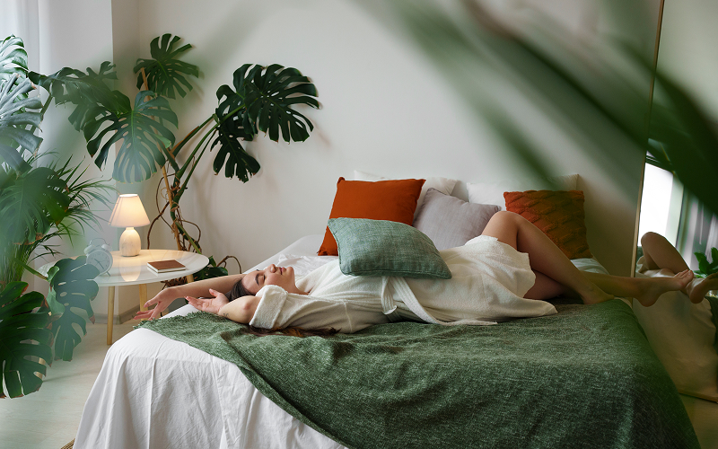 Image of bedroom with plants, wood textures and natural elements
