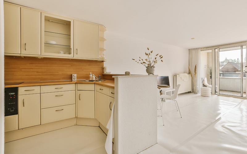 a well-designed, cream-coloured kitchen interior