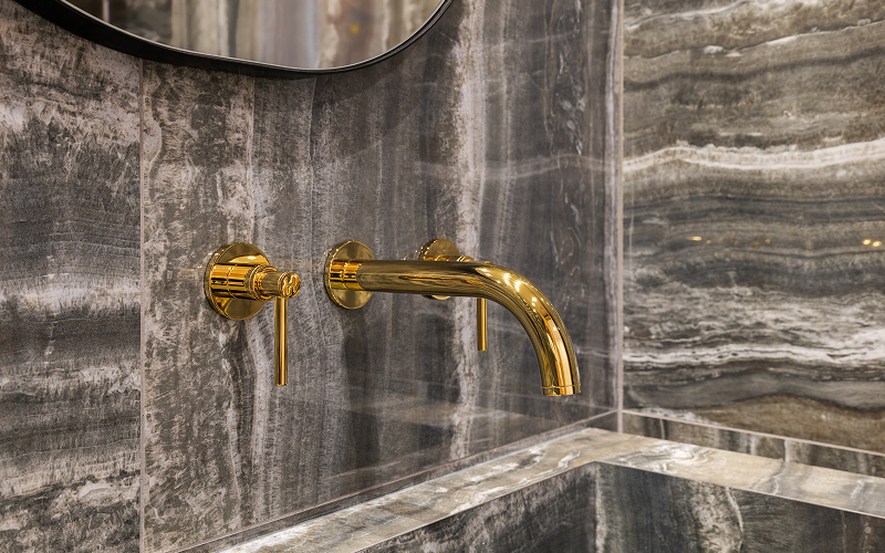 brass-coloured bathroom hardware
